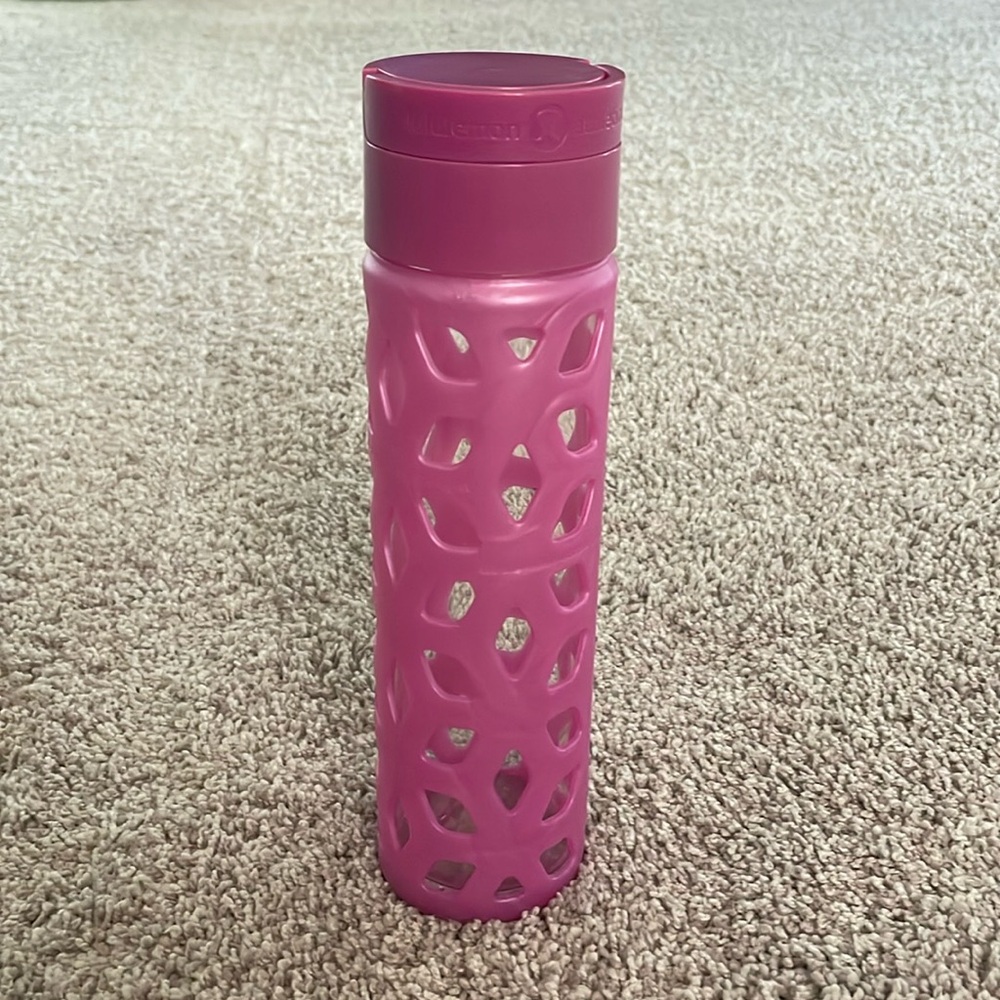 Lululemon pink glass water bottle.